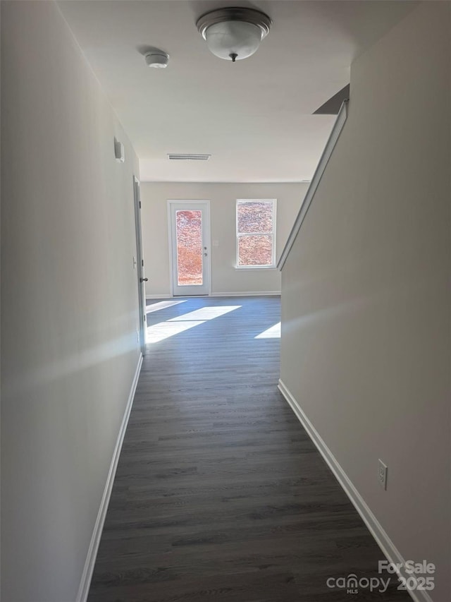 hallway featuring dark hardwood / wood-style flooring