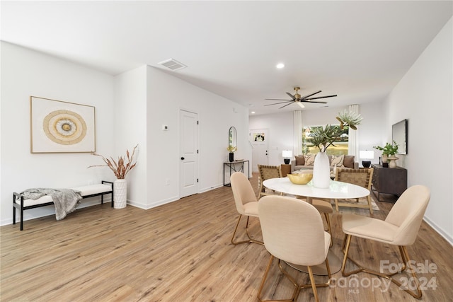 dining area featuring light hardwood / wood-style floors and ceiling fan