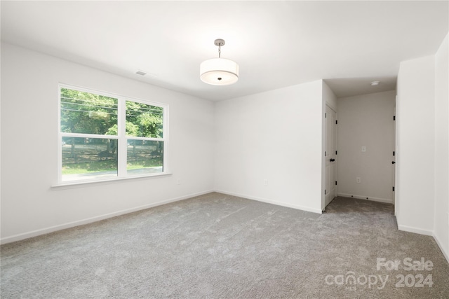 empty room with light colored carpet