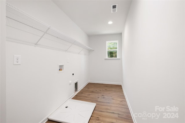 laundry room featuring hookup for an electric dryer, hookup for a gas dryer, wood-type flooring, and hookup for a washing machine