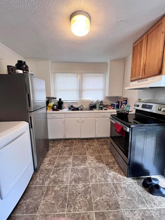 kitchen with appliances with stainless steel finishes, a textured ceiling, white cabinetry, and washer / dryer