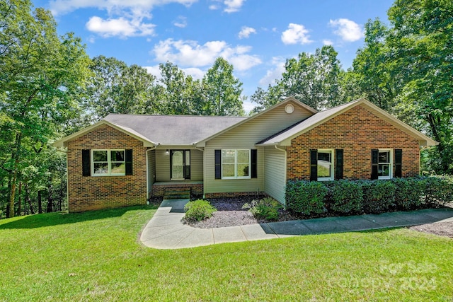 ranch-style house with a front yard