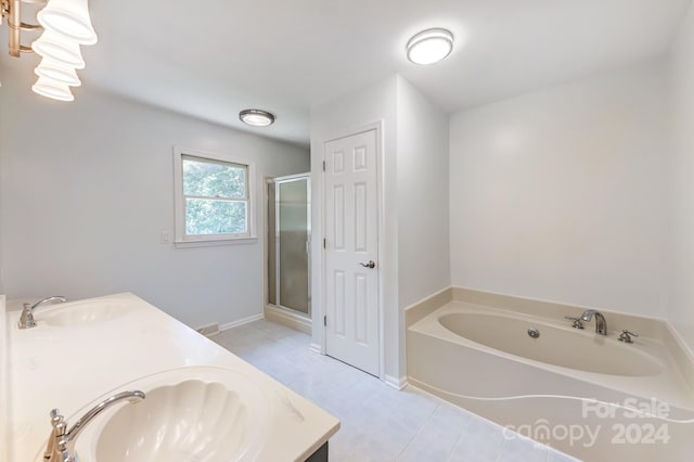 bathroom with separate shower and tub, tile patterned flooring, and vanity