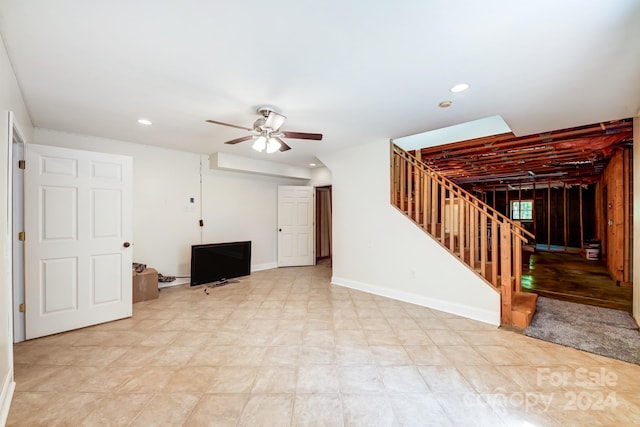 interior space with ceiling fan