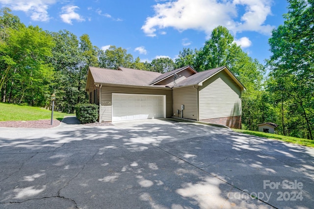 view of side of property featuring a garage