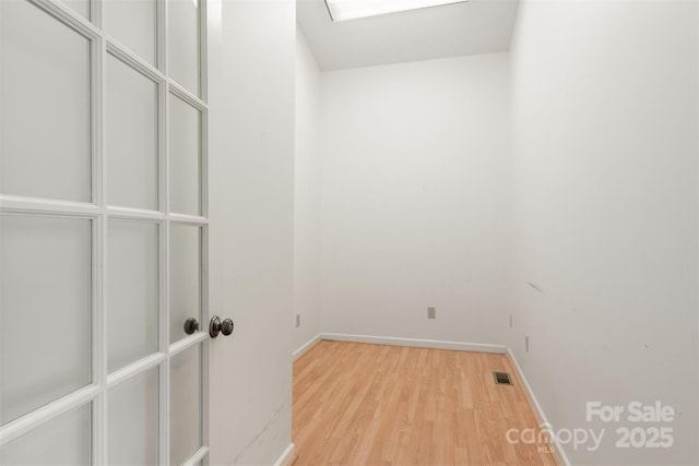 spare room with light hardwood / wood-style flooring