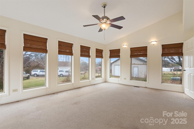 unfurnished sunroom featuring ceiling fan and vaulted ceiling