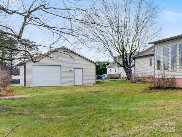 view of yard with an outbuilding and a garage