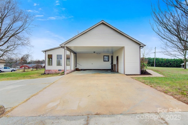 view of front of house with a front lawn and a carport