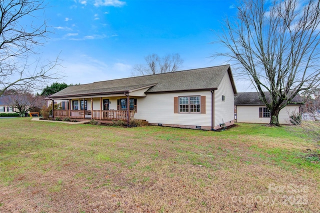 single story home featuring a front yard and a deck