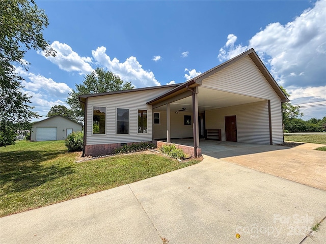 9566 Wilson Rd, Hildebran, NC 28637 - view of front of house featuring concrete driveway, a front yard, an attached carport, and crawl space