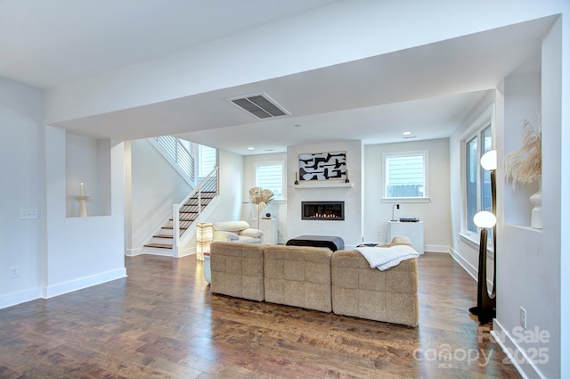 living room featuring dark wood-type flooring