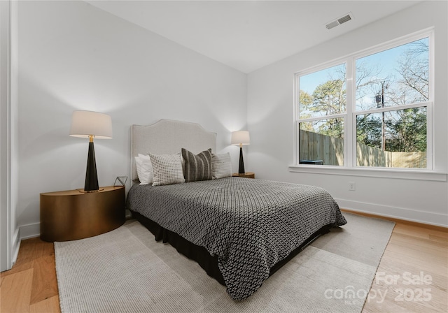 bedroom with wood-type flooring