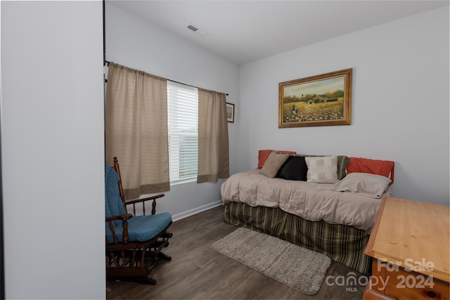 bedroom featuring dark wood-type flooring