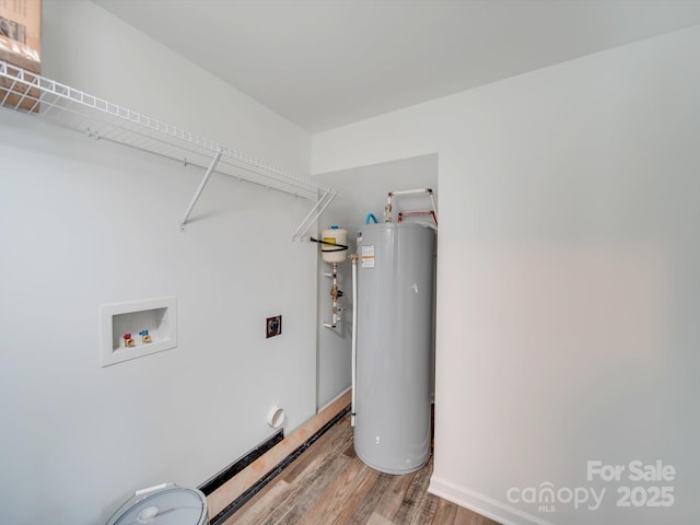 laundry area featuring water heater, hookup for an electric dryer, hookup for a washing machine, and hardwood / wood-style floors