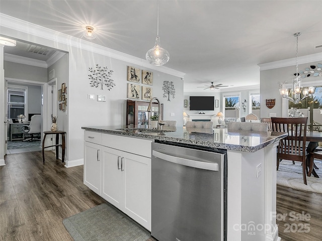 kitchen featuring sink, stainless steel dishwasher, an island with sink, dark stone counters, and white cabinets