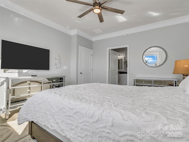 bedroom featuring ceiling fan, ornamental molding, connected bathroom, and wood-type flooring