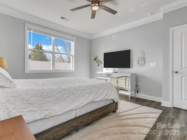 bedroom with ornamental molding, dark wood-type flooring, and ceiling fan