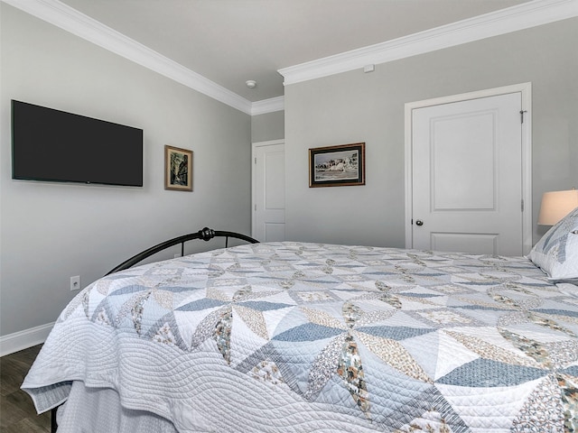 bedroom with crown molding and dark wood-type flooring