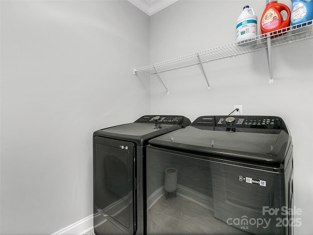 washroom featuring washer and clothes dryer