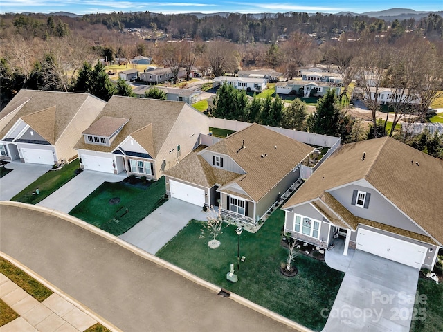 birds eye view of property with a mountain view