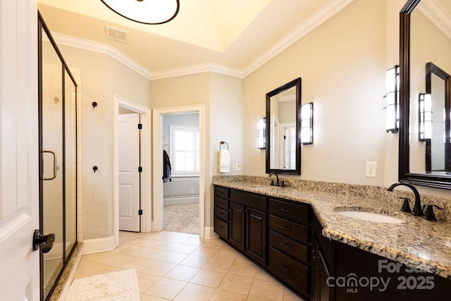 bathroom featuring tile patterned flooring, vanity, walk in shower, and ornamental molding