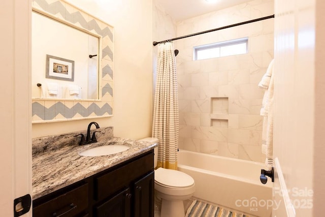 full bathroom with vanity, toilet, and shower / bath combo with shower curtain