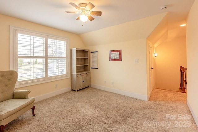 sitting room with light carpet, ceiling fan, and lofted ceiling