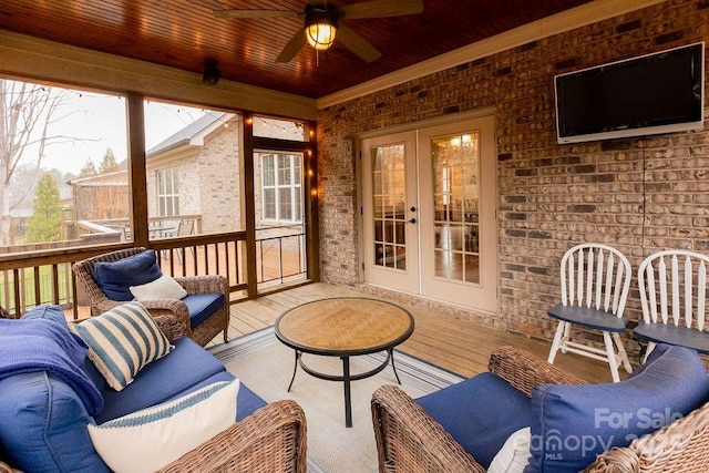 sunroom / solarium featuring ceiling fan, french doors, and wood ceiling