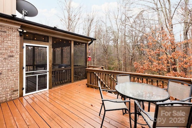 wooden terrace with a sunroom