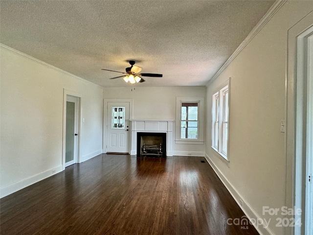 unfurnished living room with a textured ceiling, crown molding, ceiling fan, and dark hardwood / wood-style floors