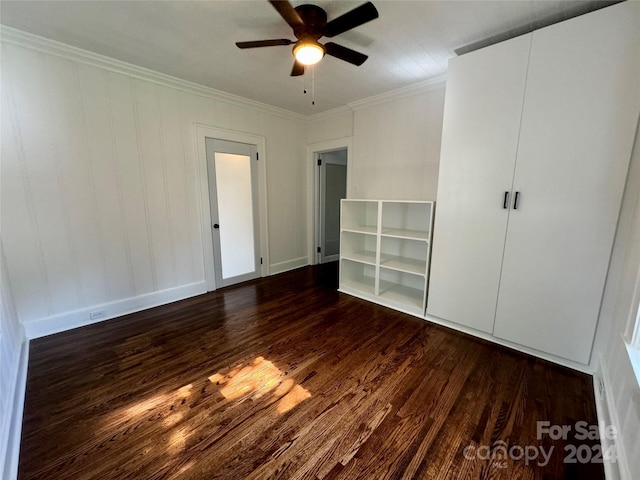 unfurnished bedroom featuring ceiling fan, dark hardwood / wood-style floors, and ornamental molding