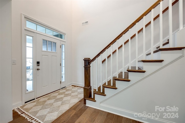 foyer entrance featuring dark hardwood / wood-style flooring