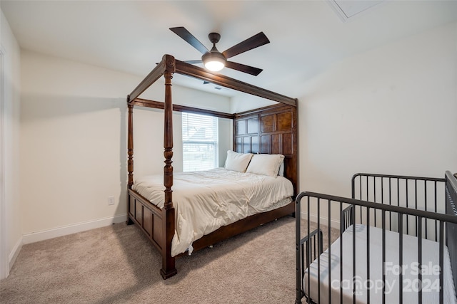 bedroom featuring ceiling fan and light carpet