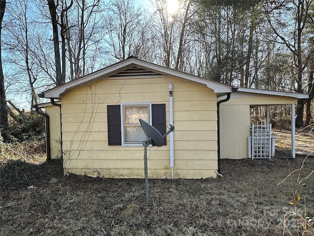 view of outbuilding featuring a carport