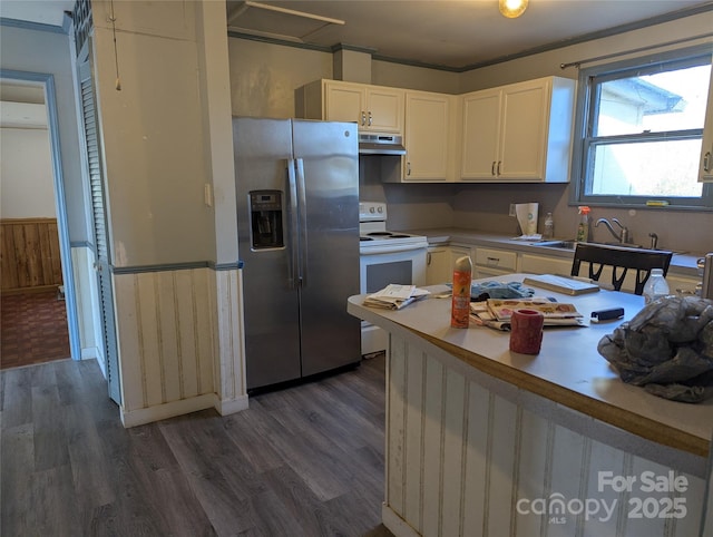 kitchen with white cabinetry, sink, stainless steel fridge, dark hardwood / wood-style flooring, and white electric range oven