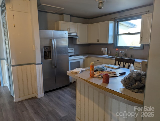 kitchen with stainless steel refrigerator with ice dispenser, dark wood-type flooring, sink, electric stove, and white cabinets