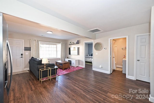 living room with dark hardwood / wood-style flooring