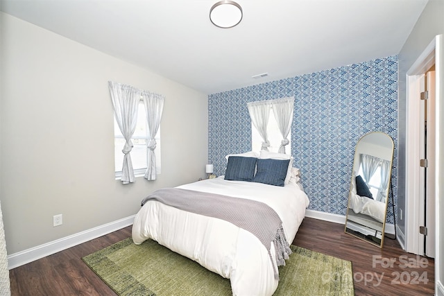 bedroom featuring dark wood-type flooring