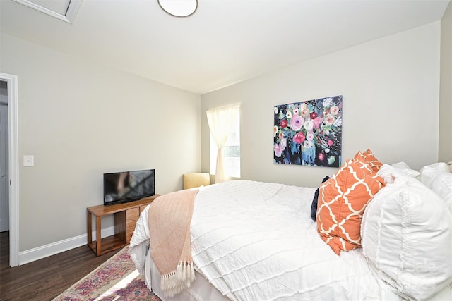 bedroom featuring dark hardwood / wood-style flooring