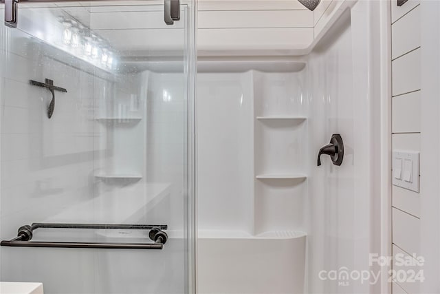 bathroom featuring an enclosed shower