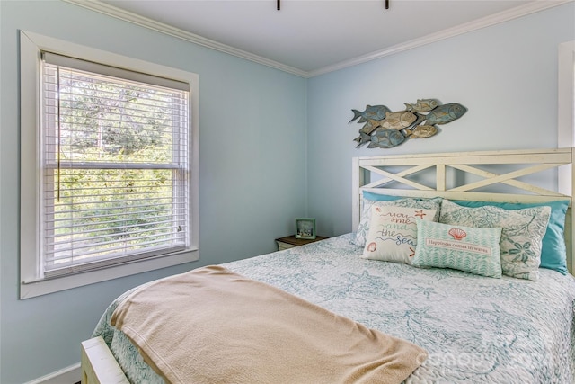 bedroom featuring multiple windows and ornamental molding