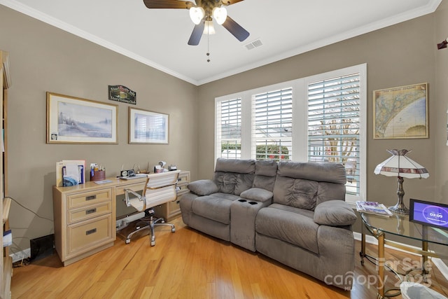 office featuring ornamental molding, light hardwood / wood-style floors, and ceiling fan