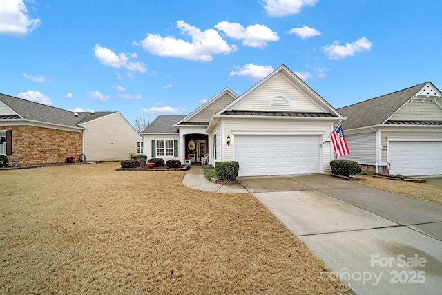 view of front of house with a garage and a front lawn