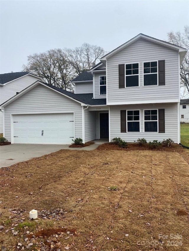 view of front of property with a garage