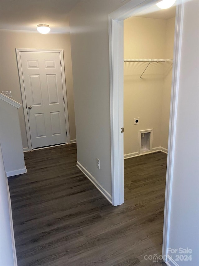 hallway with dark hardwood / wood-style floors