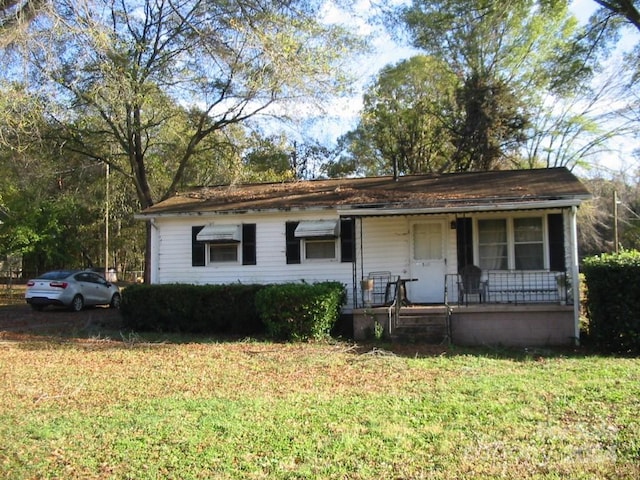 view of front of house featuring a front yard and a porch