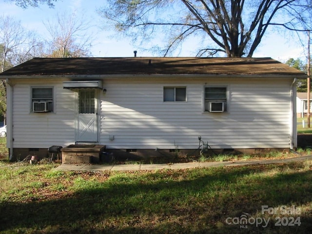 back of property featuring cooling unit