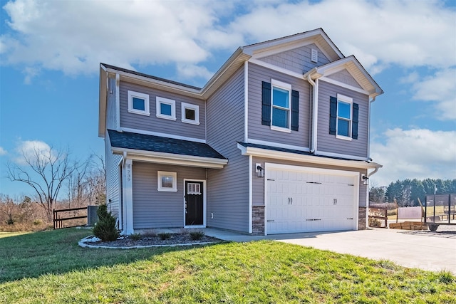 view of front of house with a front yard and a garage