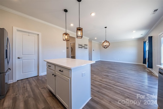 kitchen featuring a center island, dark hardwood / wood-style floors, stainless steel fridge, decorative light fixtures, and white cabinets